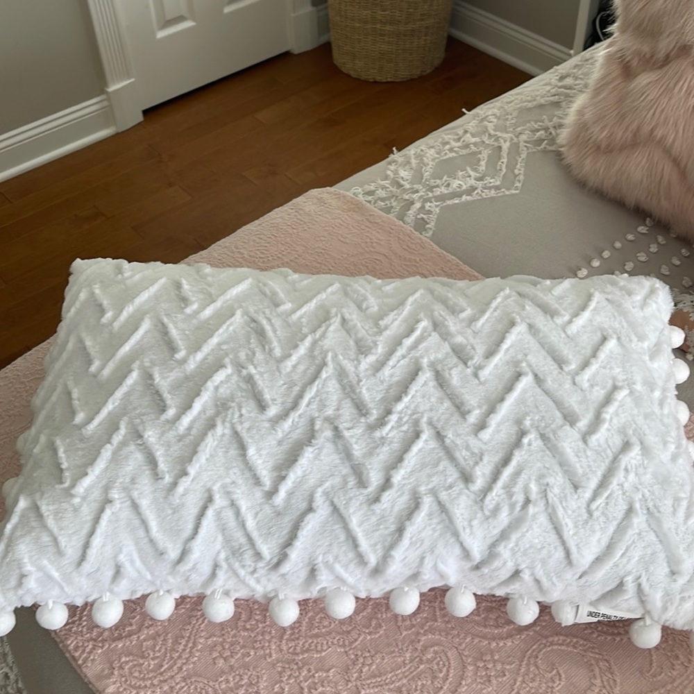 White faux fur pillow